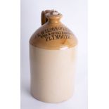 Stoneware flagon 'J.R.Wilson (Plymouth) Limited Wine and Spirits Merchant', height 33cm.
