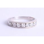 An 18ct white gold half eternity ring set with diamonds, approx. 0.55ct, estimated colour and