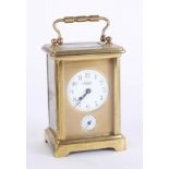 A French alarm carriage clock, brass case, the dial marked E. Bedin, Champs Elysees, France, with
