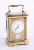 A French alarm carriage clock, brass case, the dial marked E. Bedin, Champs Elysees, France, with