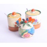 Clarice Cliff, condiment pots including two Crocus and one Fantasque (3).