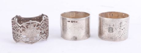 A pair of Geo V Chester silver napkin rings and a Pearce and Sons silver napkin ring (3),4.75 oz.