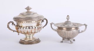 A continental silver handled cup and cover marked 800, together with a smaller similar model (2)