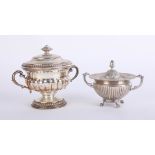 A continental silver handled cup and cover marked 800, together with a smaller similar model (2)