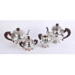 Silver? A four piece continental tea service, unmarked, with faux rosewood handle and finial,