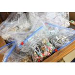 A large collection of seventeen bags of costume jewellery including pearls, bead necklaces,
