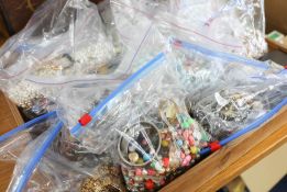 A large collection of seventeen bags of costume jewellery including pearls, bead necklaces,