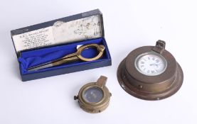 A brass cased pocket compass, a replica chart divider of the style used on the English Warship HMS