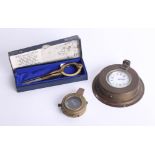 A brass cased pocket compass, a replica chart divider of the style used on the English Warship HMS