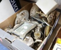 A collection of mixed silver and silver plated wares including silver photo frames etc.