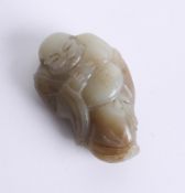 An oriental green jade carving of an man in gown, length 7cm.