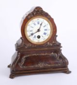 A Victorian walnut cased mantle clock with enamel dial with Roman Arabic numerals (damaged) height