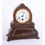 A Victorian walnut cased mantle clock with enamel dial with Roman Arabic numerals (damaged) height