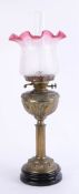 An oil lamp, height 65cm.