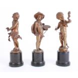 After Franz Iffland (German 1866-1935), three bronze figures of children, the arts, two signed, each