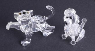 Swarovski Crystal Glass, 'Lion Cub' together with 'Poodle Sitting', boxed.