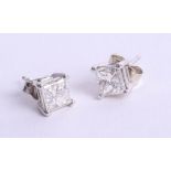 A pair of white gold and diamond set earrings, 14k, princess cut diamonds.