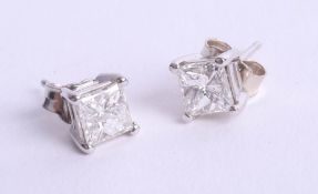 A pair of white gold and diamond set earrings, 14k, princess cut diamonds.