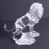 Swarovski Crystal Glass, 'Lion Standing on a Rock', boxed.