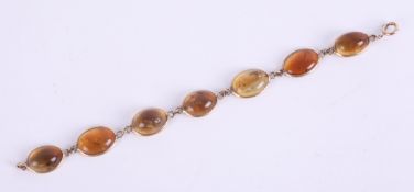 A 9ct citrine bracelet, set with 7 stones, length 19cm.