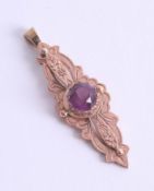 Antique rose gold purple stone set pendant, centre stone approx. 8mm, approx. 4.5g.