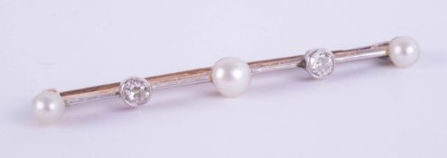 A diamond and pearl five stone bar brooch set in unmarked yellow metal, length 54mm.