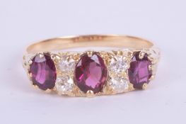 An 18ct Edwardian ruby and diamond set ring, size Q.