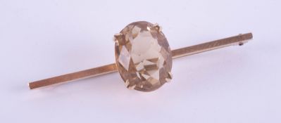 A 9ct brooch set with a large citrine, length 52mm.
