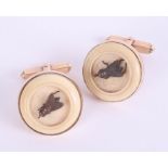 An interesting pair of antique gold and ivory bug cufflinks.