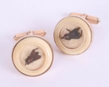 An interesting pair of antique gold and ivory bug cufflinks.