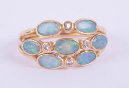 A 9ct modern opal oval cluster ring size M, with a copy of recent insurance valuation at £300.