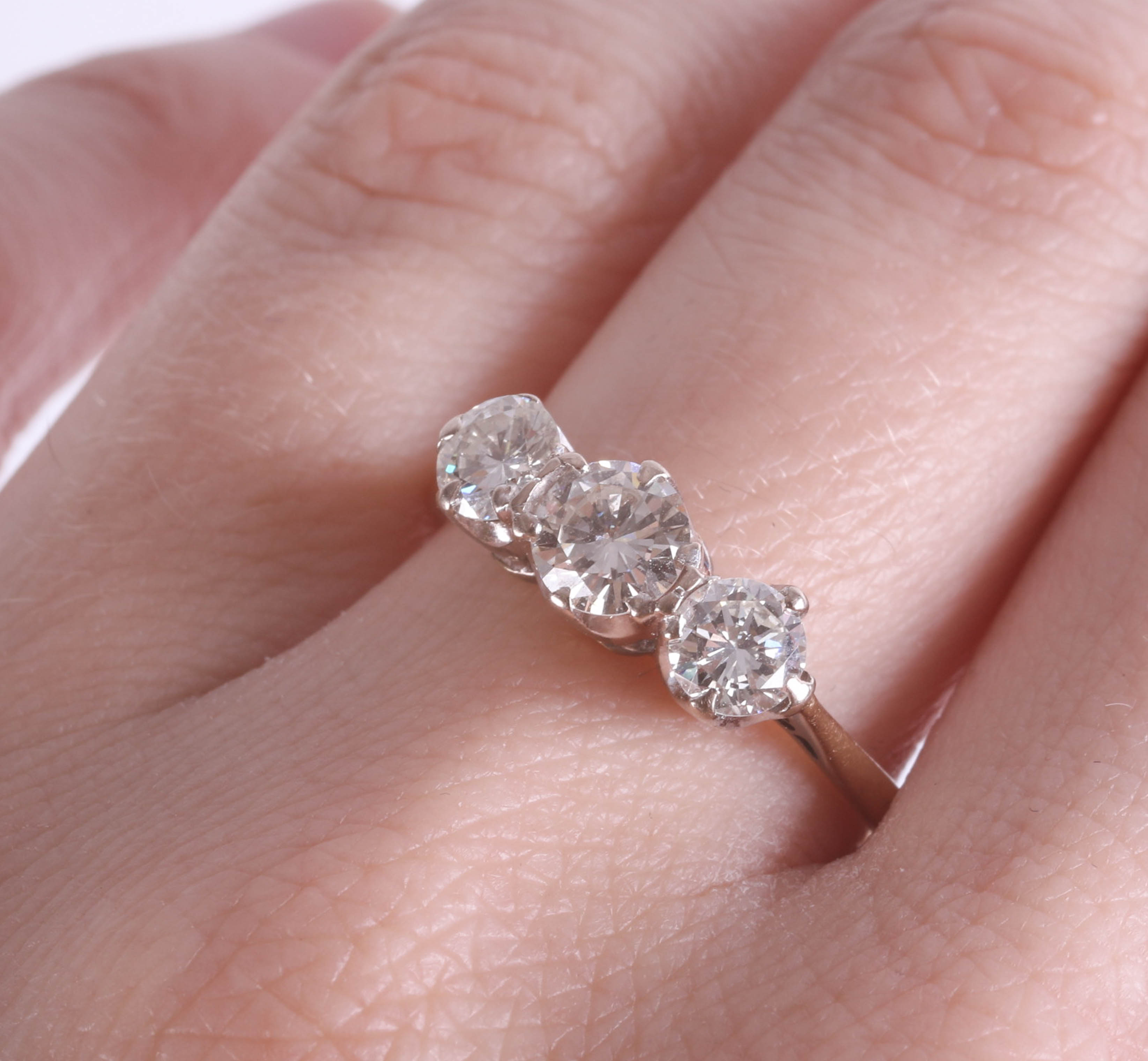 An 18ct diamond three stone ring, approx. 1ct, size T. - Image 2 of 2