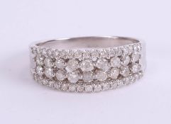 A 9ct white gold and diamond set band ring, size T.
