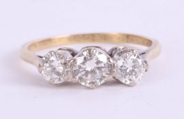 An 18ct diamond three stone ring, approx. 1ct, size T.
