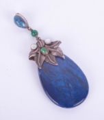 An arts and crafts lapis pendant mounted in silver and moonstone.