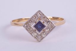 An 18ct yellow gold sapphire and diamond square ring.