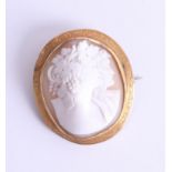 A yellow gold oval cameo brooch with double figures each with vine and grapes hair decoration,