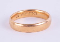 A 22ct gold wedding band, approximately 5.5g.