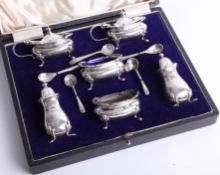 Cased silver 6-piece condiment set by Walker & Hall of Sheffield with 6 mustard spoons, Chester.