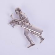 A silver brooch, modelled as a golf player, marked sterling 925, height 55mm.