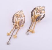 A pair of Mansura Arabic high carat gold earrings, Arabic markings with purchase box marked Damas,