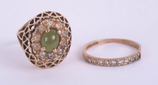 An 9ct band ring with another jade style ring marked 18ct.