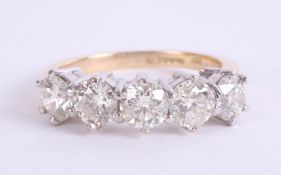 A large diamond five stone ring, set in yellow gold, size S.