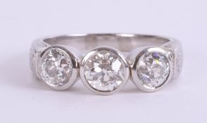 A fine platinum and diamond set three stone ring, approximately 2.60ct, size U.