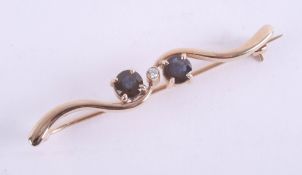 A 9ct sapphire and diamond set brooch, set in yellow gold.