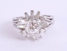 A contemporary diamond ring, set with round and baguette cut diamonds, approximately 1ct, size M.