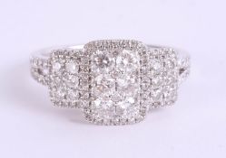 A 14ct white gold and diamond set 'square' cluster ring, size O.