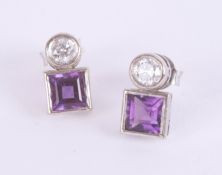 A pair of 18ct diamond and amethyst set earrings, the amethyst square cut.