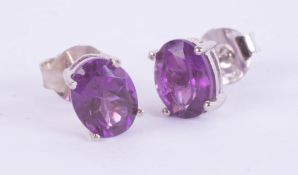 Pair of silver studs set with amethyst