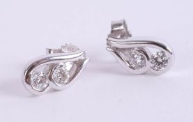 A pair of diamond contemporary white gold earrings.